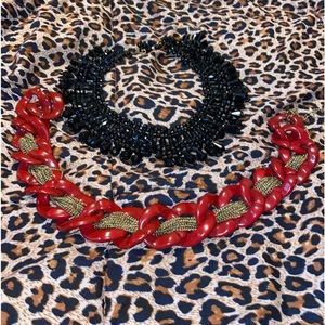 Two lovely bold necklaces one looks like a bib on.